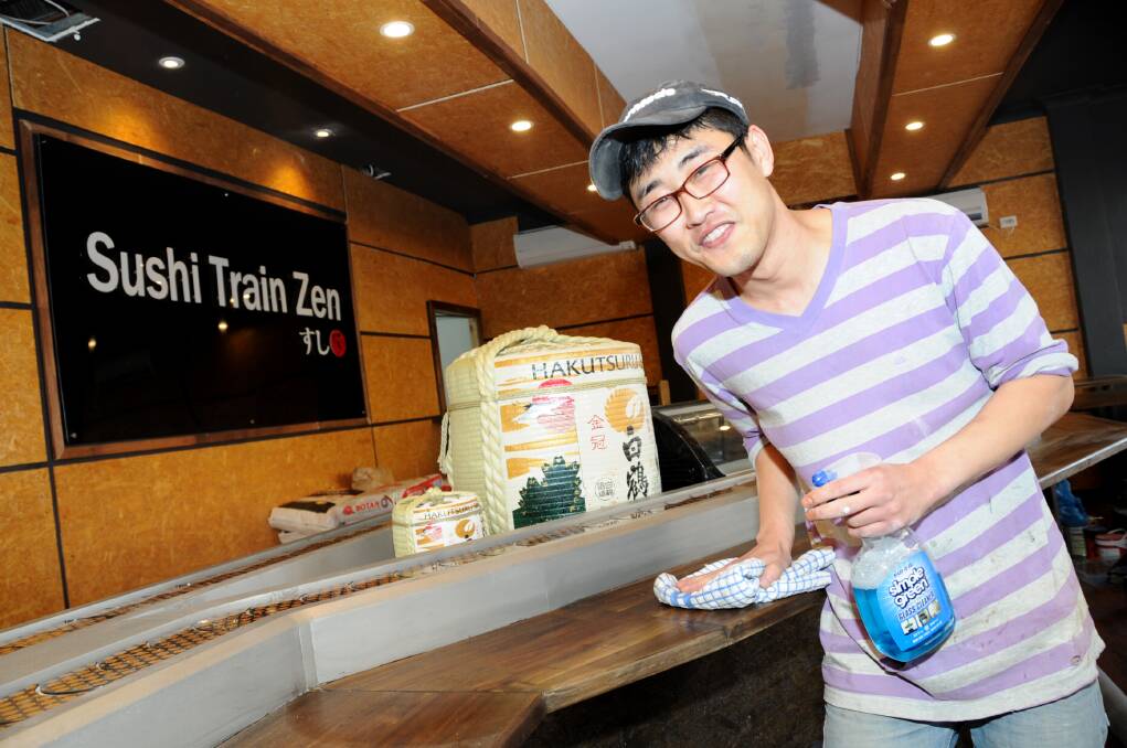Nathan Jeon preparing a renovated premises in the centre of Dubbo ahead of its opening as an eatery with a sushi train.									       Photo: LOUISE DONGES