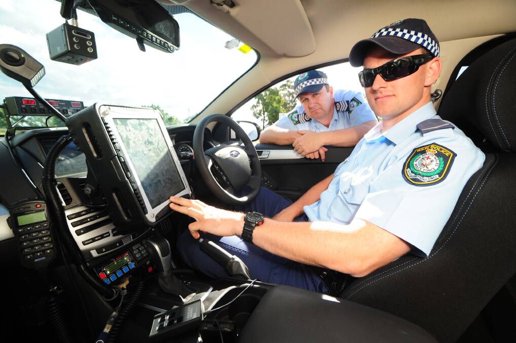 Highway patrol officers Sergeant Jason Bush and Constable Nick Richardson prepare for an operation targeting key offences to keep drivers on Dubbo region roads safe during the four-day Easter break.			 Photo: BELINDA SOOLE