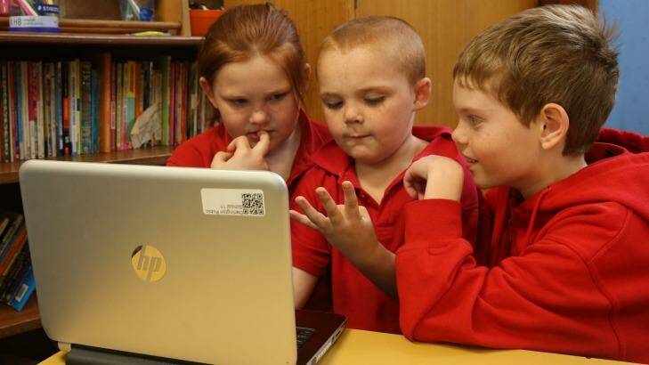 School children work off a computer at Darlington Public School.  Photo: Louise Kennerley