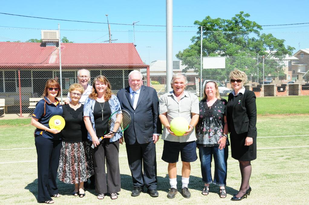 Anne Bassett (Camp Quality), Marg Rootes, Colin Rootes, Anne Barwick, Tom Toohey (Dubbo RSL), Ken Bailey, Gladys Thornberry and Anne Mills (Dubbo RSL) at the cheque presentation at Muller Park. Photo: NICK GUTHRIE