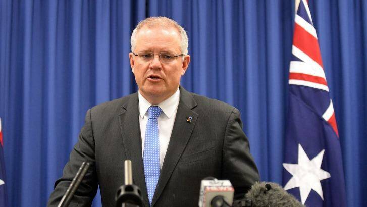 Treasurer Scott Morrison is widely expected to follow through with a final decision on the Ausgrid sale this week. Photo: Bradley Kanaris