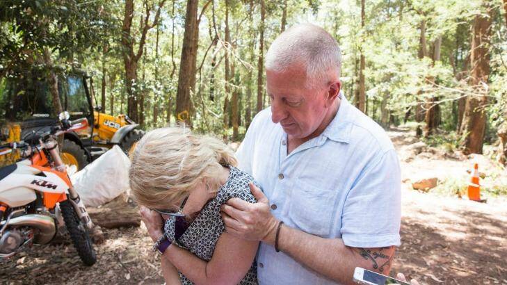 Mark Leveson comforts his wife, Faye, as the search for their son Matthew's body in the Royal National Park is called off. Photo: Jessica Hromas
