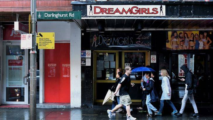 People walk past the entrance to DreamGirls on Darlinghurst Road in Kings Cross, Sydney.  Photo: Kate Geraghty