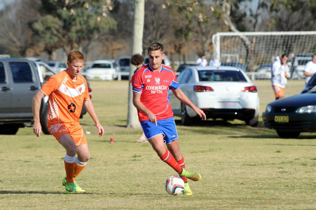 Ben Manson in action for Orana Spurs against Dubbo FC s Michael Connolly earlier this year. The two sides will meet in this weekend s grand final.  
Photo: Belinda Soole