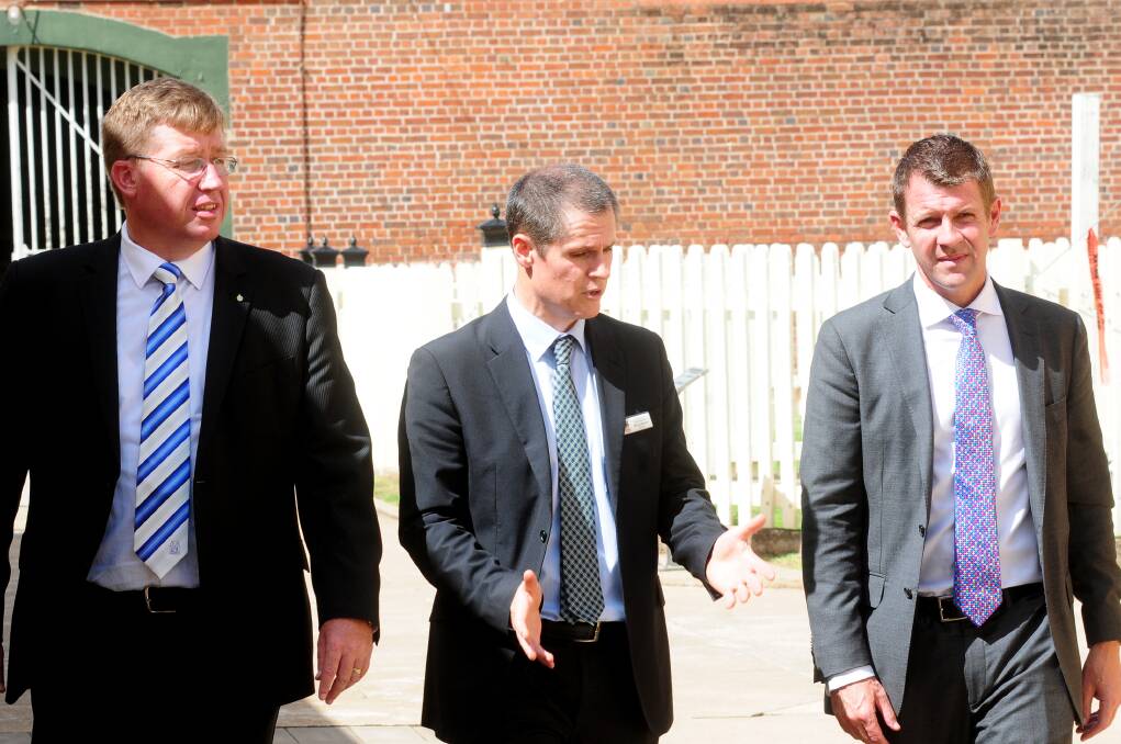 Dubbo MP Troy Grant, Dubbo mayor Mathew Dickerson and then-treasurer Mike Baird at the Old Dubbo Gaol on April 3 when Mr Baird offered up $1 million for the attraction from the Cobbora Transition Fund. Photo: LOUISE DONGES