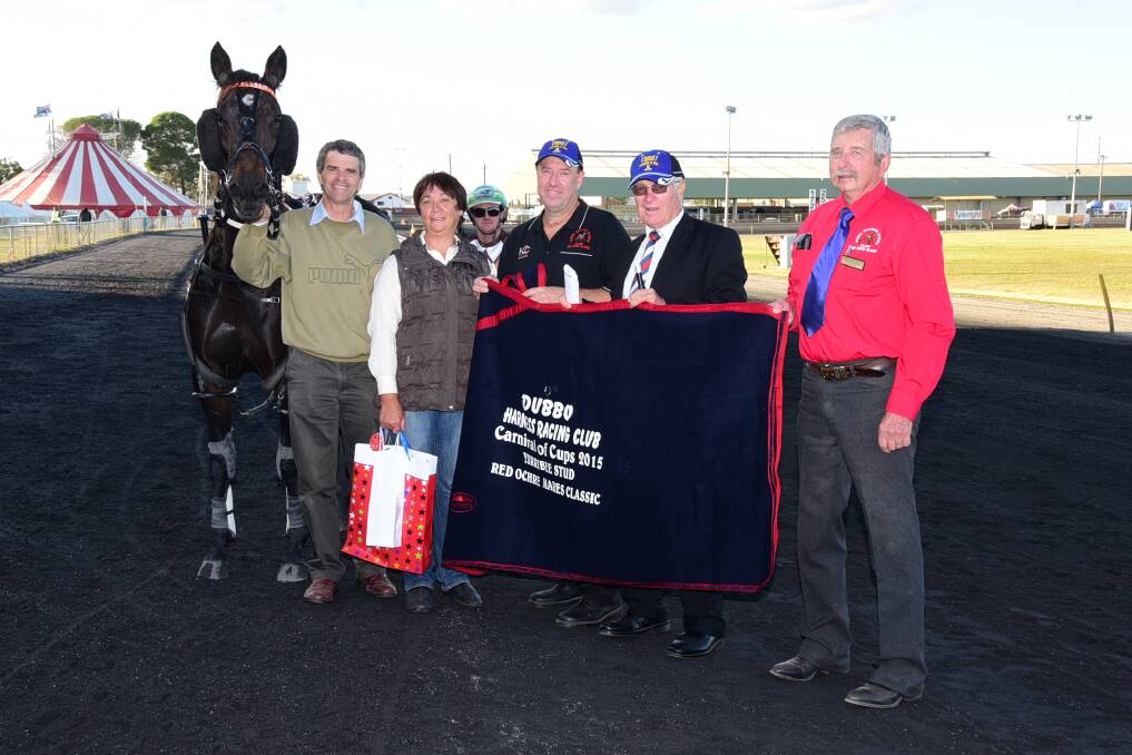Freedom Is with owners Phillip and Denise Thurston, Red Ochre organiser Brett Wrigley, Chris Edwards (Harness Racing NSW) and Len Edwards (Dubbo Harness Racing Club president) after Sunday's Red Ochre Mares Classic at Dubbo Paceway. 						   Photo: BELINDA SOOLE