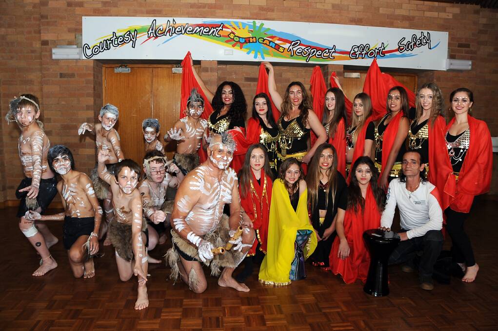 Indigenous-themed belly dancers at Dubbo College South Campus. Back: Travis Finlay, Ty Sutherland, Coen Naden, Buddy Kennedy,Tallulah Ambrose, Emily Coleman, Priscilla Ambrose-Kassis, Tamikah Melville, Chloe Coleman, Tamika Kennedy, Sam Williams and Angela Canalese. Front: Kijuan Dodd, Blake Dodd, Lewis Rosser, Uncle Ralph Naden, Hailey-May Ley-Andrews, Maryam Kassis, Madison McGuinness, Courtney Dodd and Abraham Kassis.	Photo: BELINDA SOOLE