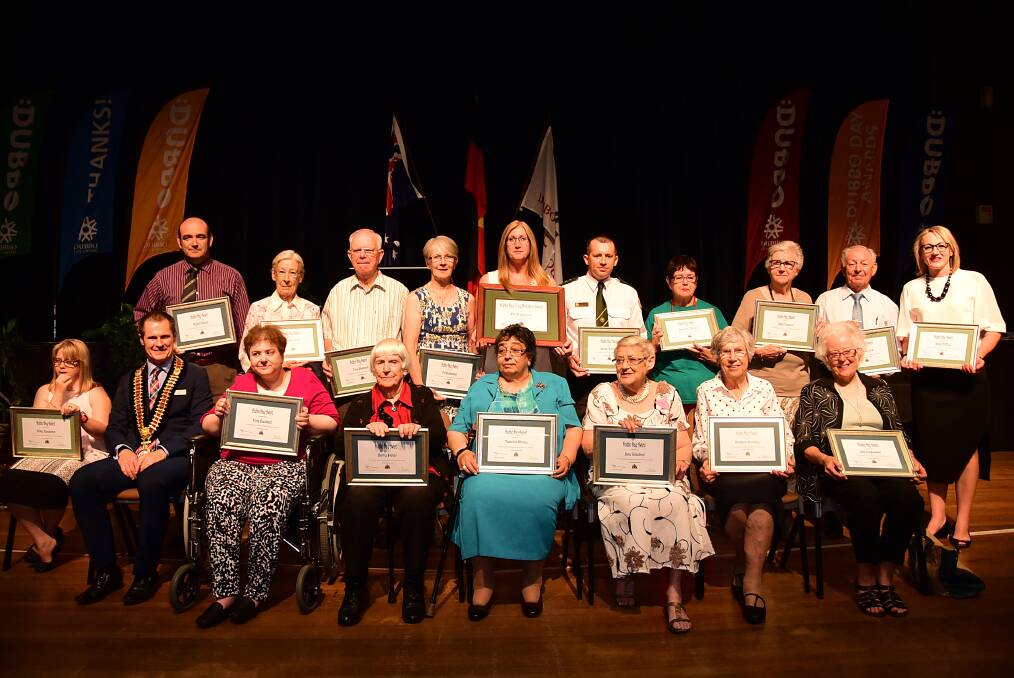 Volunteers Rob Exner, Rosemary Green, Tony Wheatland, Val Buchanan, Di Pascoe, David Chenhall, Lorraine Scoble on behalf of Barbara O Brien, Ingrid Jackson, John Rodis and (front) Kirsty Henderson, Fiona Woodward, Betty Peter, Themelina Whitney, Jane Grindrod, Margaret Woodley and Nola Younghusband after receiving honours at the Dubbo Day Awards ceremony, with Dubbo mayor Mathew Dickerson (front second from left). 			  Photo: BELINDA SOOLE