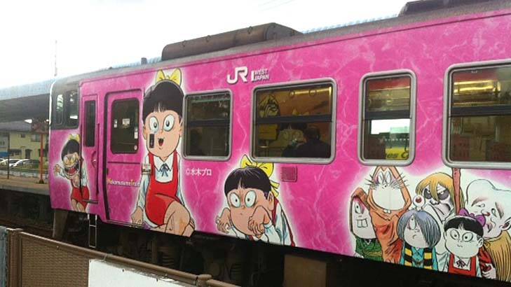 A train emblazoned in manga characters. Photo: Sarah Maguire