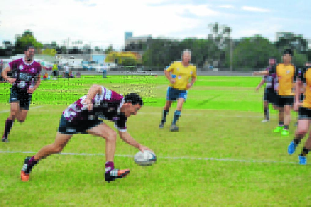 Ben Power crosses for one of the Redbacks four tries.	Photo: FARREN HOTHAM