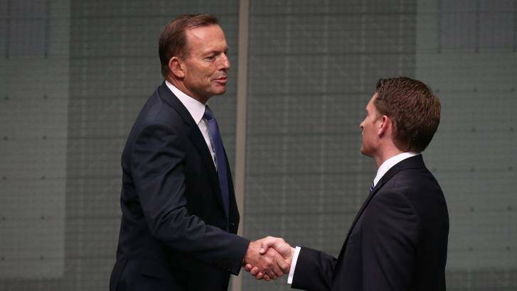 Mr Hastie is congratulated by former prime minister Tony Abbott. Photo: Alex Ellinghausen