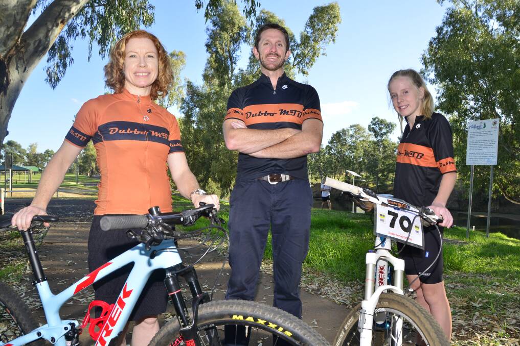 Simone Grounds, Neil Diamond and Haylee Fuller are urging people to come out and try mountain biking at the Dundullimal track on Sunday. Photo: BELINDA SOOLE