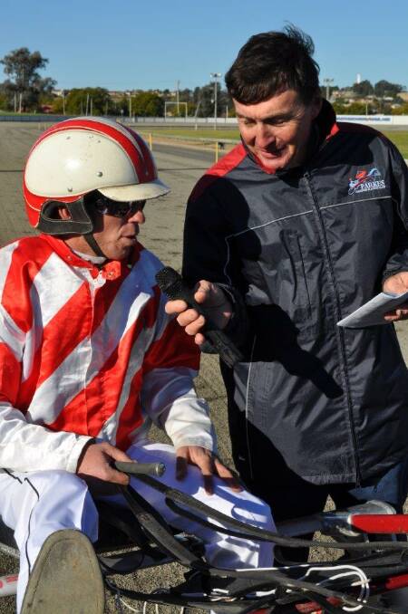 Saint Dal Santo s trainer-driver Nathan Hurst is interviewed by Parkes Harness Racing Club president Geoff Cole.