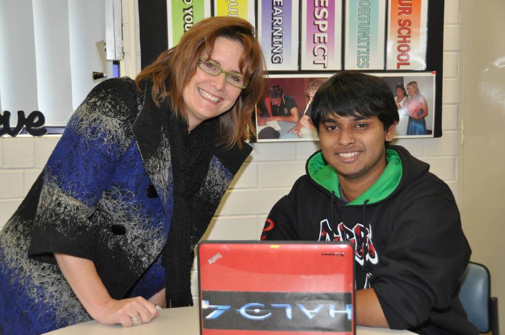 Dubbo College acting executive principal Stacey Exner with year 10 student Chayan Deb Nath who is enrolled at three schools to complete his education. 
 
                                                                                                              Photo: CONTRIBUTED