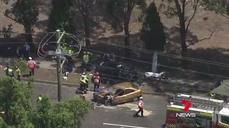 Emergency services at the scene of a car crash at Cabramatta  in which a woman and man died last Wednesday.  Photo: Seven News Sydney