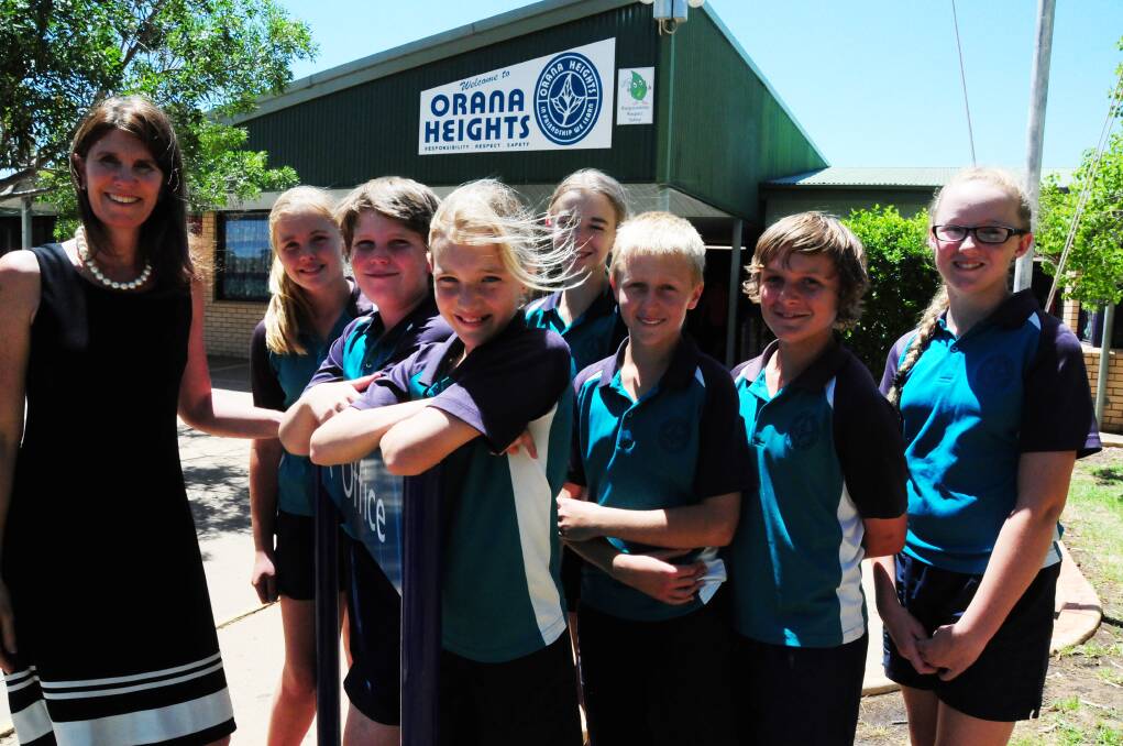 Orana Heights Public School principal Annie Munro and Student Representative Council members Kenzie McFarlane, George Munro, Jessica Ware, Emily O'Dea, Cameron Bruce, Zac Newby and Holly Darlington are excited about the 2015 funding allocation for the school. Photo: GREG KEEN