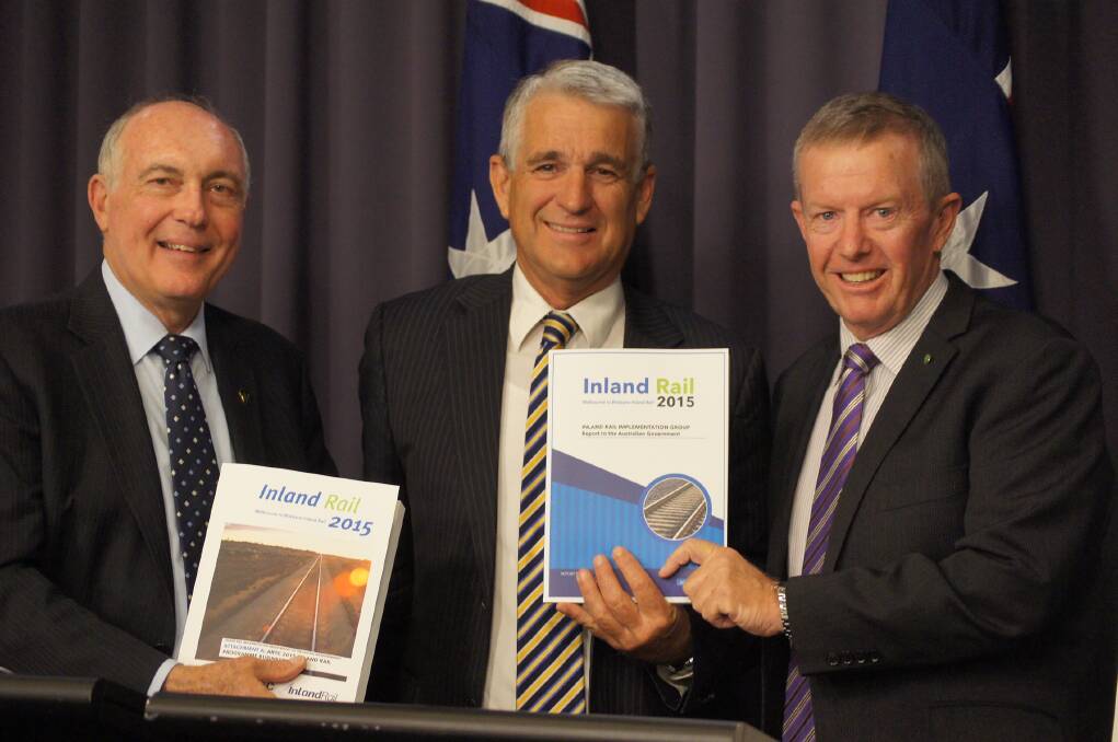 Deputy Prime Minister and Minister for Infrastructure and Regional Development, the Hon Warren Truss MP receiving the final report of the Inland Rail Implementation Group from chair John Anderson AO with Federal Member for Parkes Mark Coulton.
