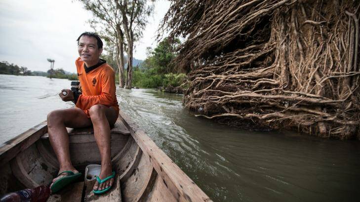 Siett Chanthasounthone on his way to check his fishing nets. Photo: Jason South