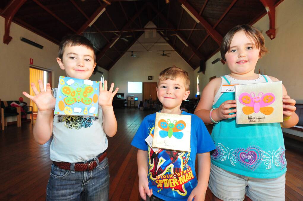 Siblings Will, Tom and Katie McCullough with their Easter butterfly artworks.      Photos: LOUISE DONGES