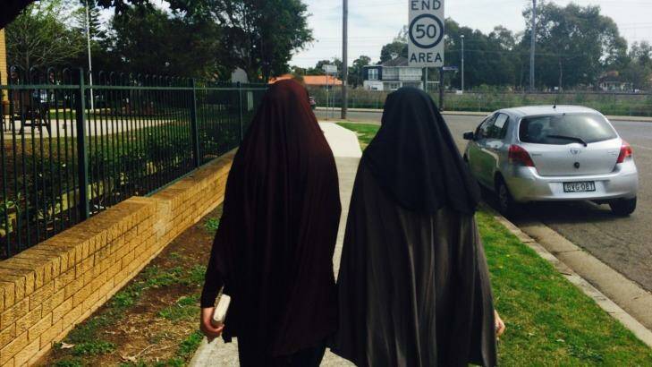 The sisters of terrorism accused Omarjan Azari in Guildford.  Photo: Emma Partridge