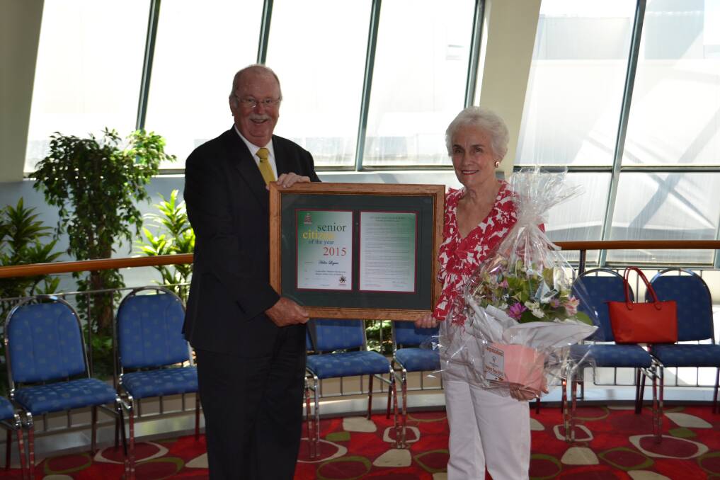 Councillor Allan Smith presents the 2015 Senior Citizen of the Year award to Helen Logan.