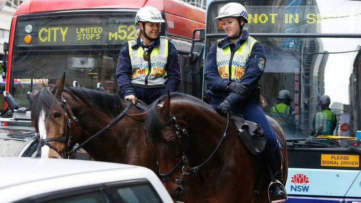 Mounted police patrol Sydney CBD during morning rush hour on Friday. Photo: Daniel Munoz