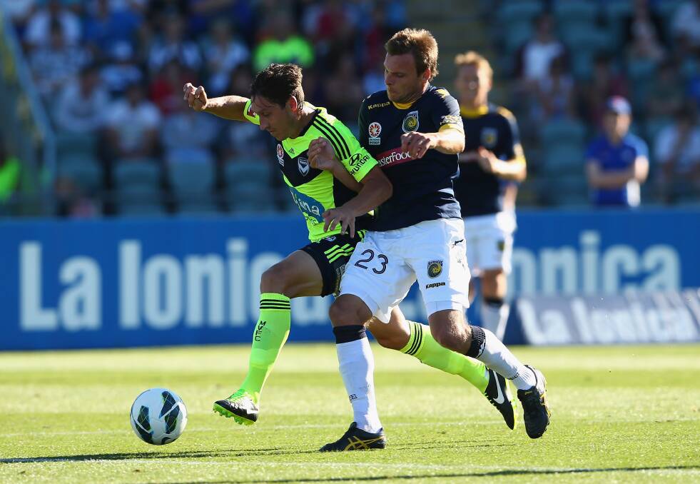 Adam Kwasnik (right), pictured during his days with the Central Coast Mariners, will be at Dubbo next month for a week-long training clinic. 	Photo: GETTY IMAGES