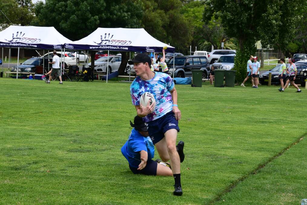 Jeremy Tooth beats a defender during the touch football gala day.