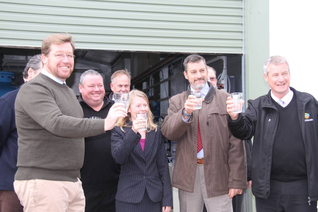 Deputy premier Troy Grant, Wellington Council environmental services manager Gretel Purser, mayor Rod Buhr and CEO of NSW Crown Holiday and Parks Trust Steve Edmonds holding glasses in a toast to the new treatment plant. 	Photo: MICHELLE BARKLEY