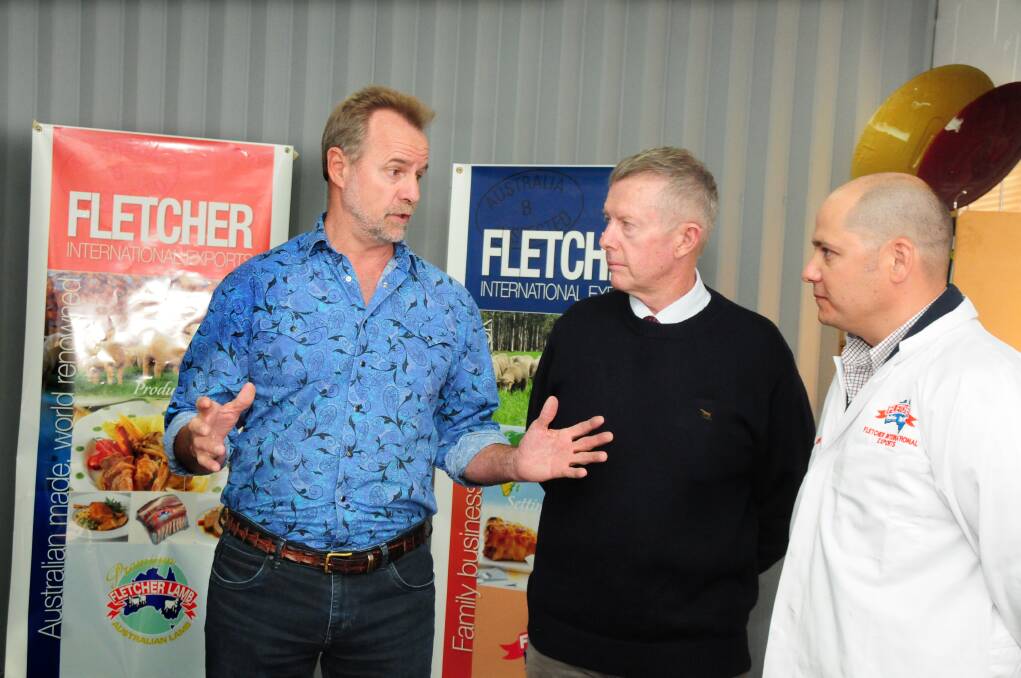 Federal Indigenous affairs minister Nigel Scullion discusses Dubbo s Get Real program with Parkes MP Mark Coulton and Farron Fletcher from Fletcher International Exports after announcing $1.6 million in funding. 							     Photo: LOUISE DONGES