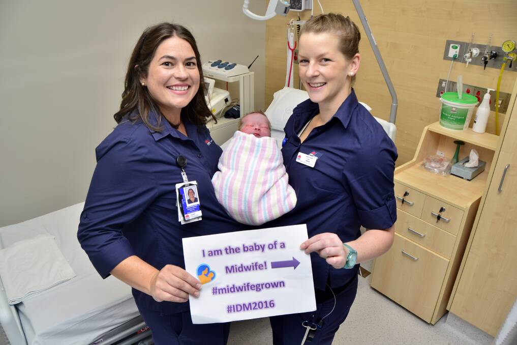 Expecting midwives Jaime Pulling-Allen (due June 11) and Leesa Weber (due June 27) with the baby boy of April Hegarty, who was born at 10.12am on Thursday, the International Day of the Midwife. 																    Photo: BELINDA SOOLE
