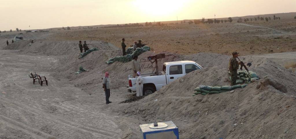 Local tribal fighters dig in against Islamic State militants in the town of Amriyat al-Falluja in Anbar province.