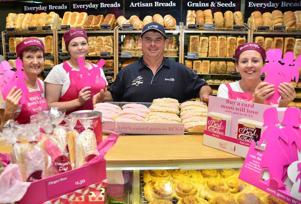 Bakers Delight employees Vicki Fullerton, Kelsie Hill, Kerry Batten and store owner Greg Spora with some of the pink products being sold to raise money for the Breast Cancer Network Australia. 								   Photo: BELINDA SOOLE