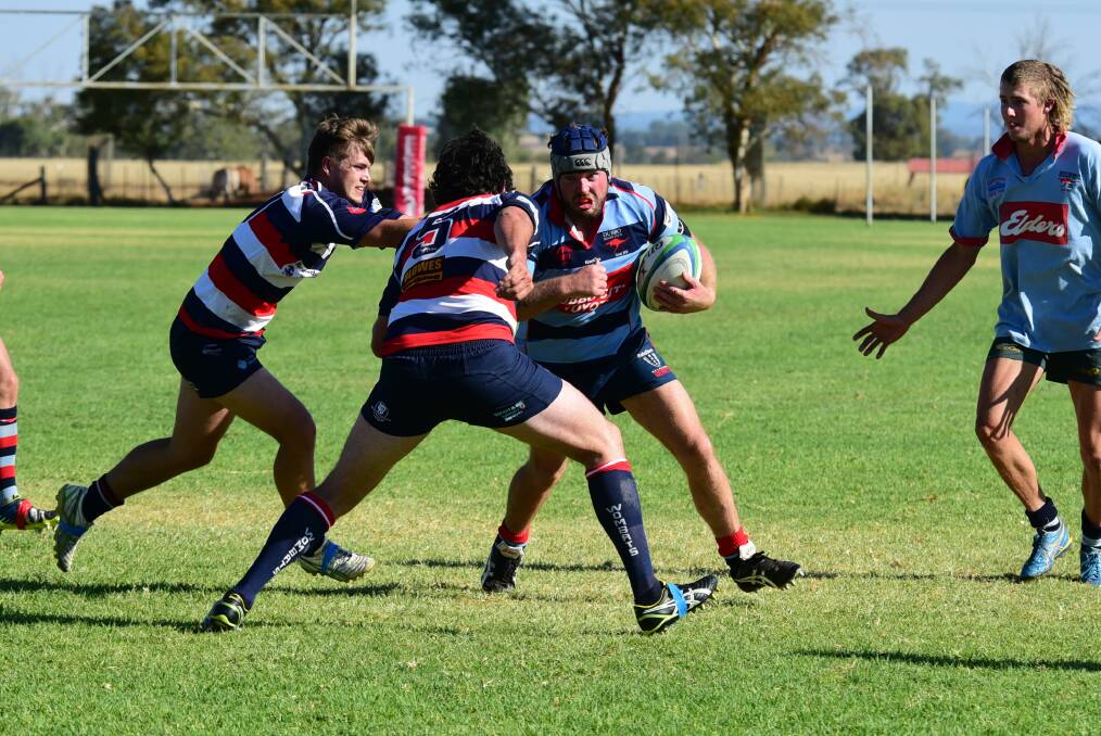 Josh Tremain powers into the Mudgee defence during Saturday s trial match at St John s College. 	Photo: CHERYL BURKE