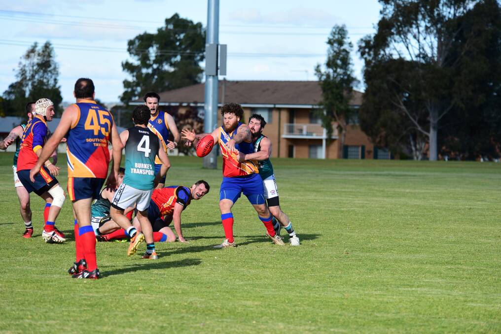 Michael Lorimer, pictured attempting to clear the ball against Bathurst recently, and his teammates will head to Cowra today in search of their first win of the season. 			     Photo: BELINDA SOOLE