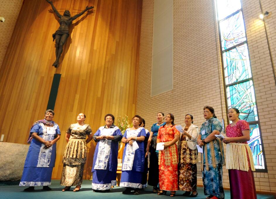 Associated Women of the World members from Fiji, Tonga and Papua New Guinea singing hymns in traditional dress. Photo LOUISE DONGES