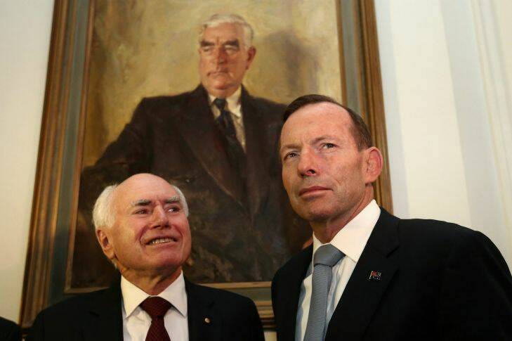 Former Prime Minister John Howard and Prime Minister Tony Abbott during the opening of "Menzies: By John Howard" exhibition', at Old Parliament House in Canberra on Wednesday 3 September 2014. Photo: Alex Ellinghausen 
GW140920