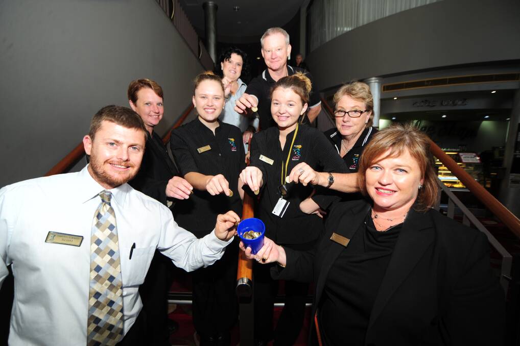 Dubbo RSL staff members Michelle Cummins, Garry Reidy (back), Kim O'Leary, Ellen Pascoe, Jade Taylor, Wendy Cox (middle), Scott Warner and Rebecca Zaia (front) donate one dollar from their wage to charity. 	Photo: BELINDA SOOLE