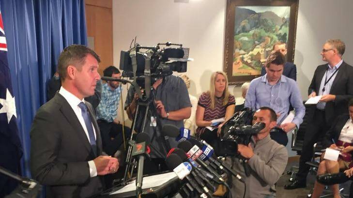 Premier Mike Baird at Tuesday's media conference announcing the reversal.  Photo: Wolter Peeters