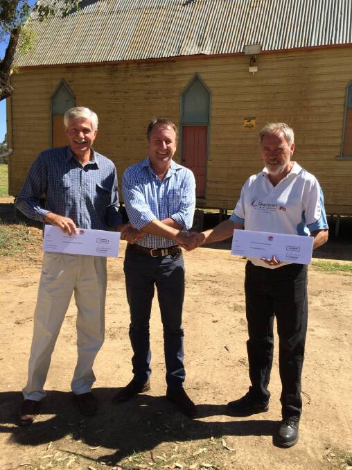 Warren mayor Rex Wilson and RiverSmart CEO Bill Phillips are presented with cheques from Barwon MP Kevin Humphries as part of the Community Building Partnership program. 			    Photo: CONTRIBUTED