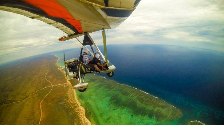 Squishy: Microlights hold two snugly and are open to the elements. Photo: Ocean Eco Adventures