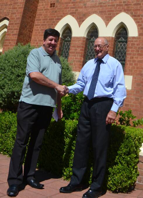 Father Tony Hennessy with Peter Duffy from Wellington s pastoral care. 		       Photo: CONTRIBUTED
