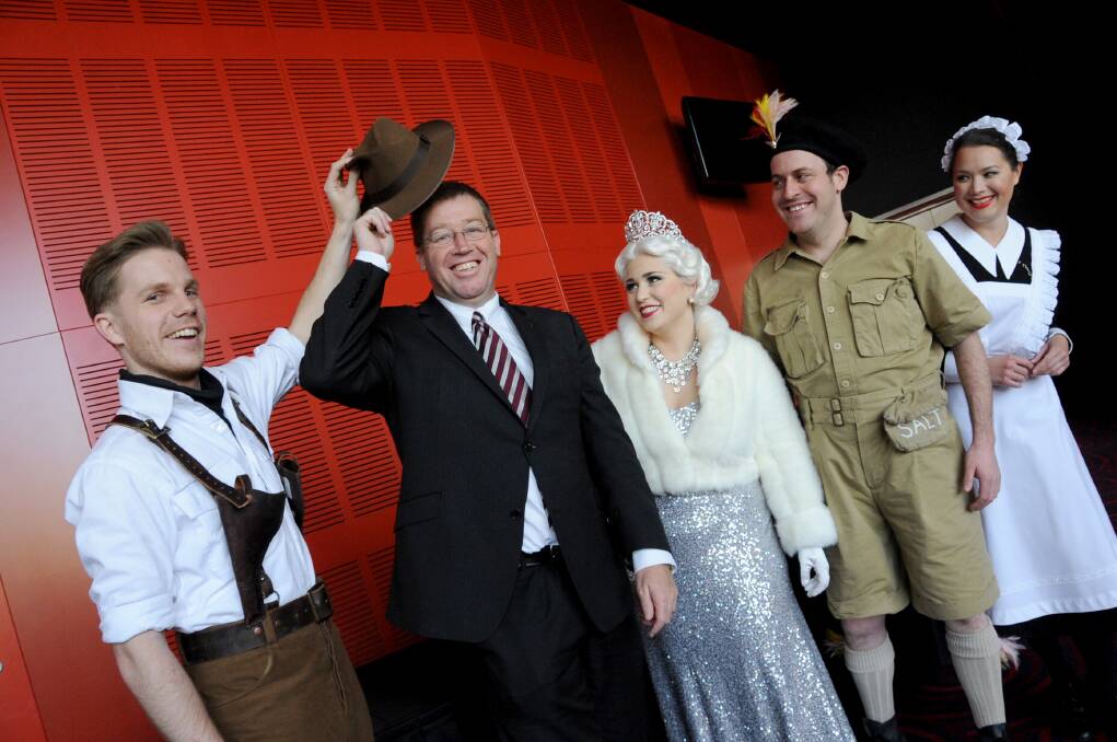 Member for Dubbo and NSW Minister for the Arts Troy Grant (second from left) tries on the character Tamino s hat, part of the costume for The Magic Flute, along with Nick Jones playing Tamino, Hannah Dahlenburg (Queen of the Night), Chris Hillier (Papageno) and Anna Yun (Third Lady). 
Photo: LOUISE DONGES