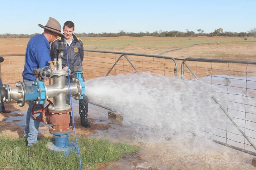 Weilmoringle farmer Ed Fessey shows Premier Mike Baird some of his daily routine. Photo: KATHERINE MATTS