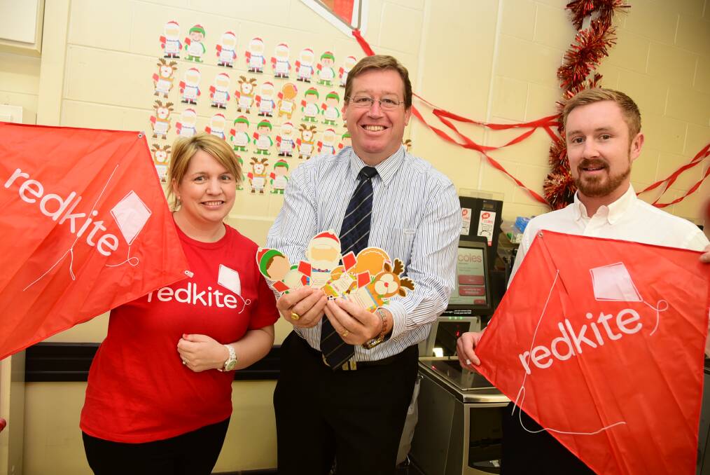 Redkite s Rachelle Peterson-Rose with Dubbo MP Troy Grant and Coles Dubbo manager Matthew Grundy. 		    Photo: BELINDA SOOLE