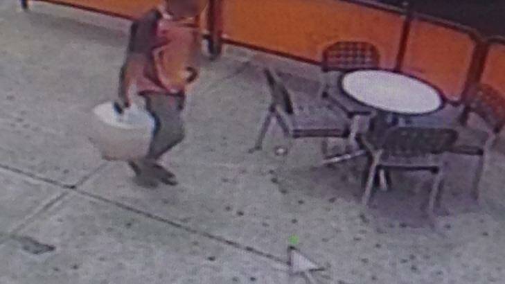 CCTV footage shows the man walking back to the bank.  Photo: supplied