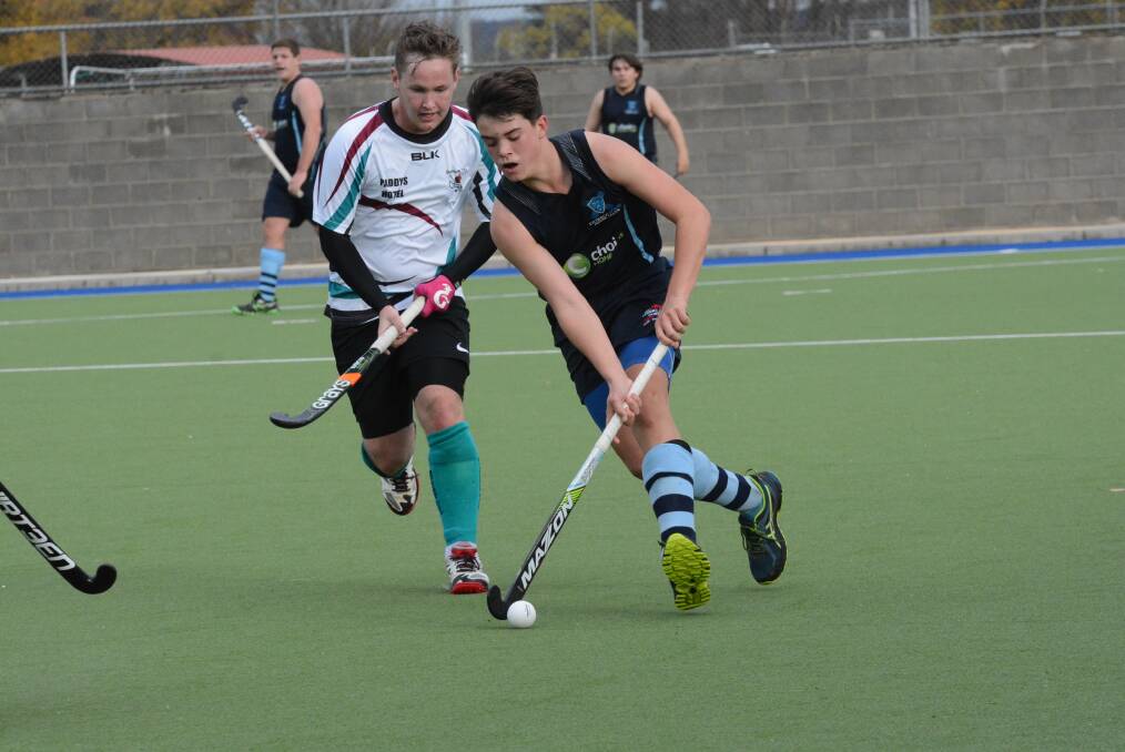 Hayden Lew battles a City player during Saturday's clash. 			          Photo: PHILL MURRAY