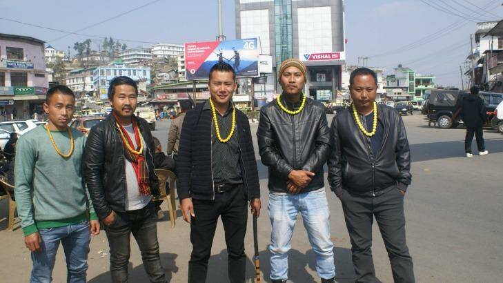 Naga men wearing yellow necklaces, a symbol of the Angami tribe, wait to block government vehicles in the streets of Kohima. Photo: Amrit Dhillon