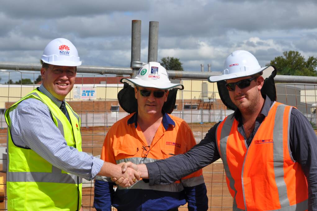 Member for Dubbo Troy Grant, site manager James McCann and workplace health and safety site representative Mark Woodgate from Broad Construction Services. Photo contributed