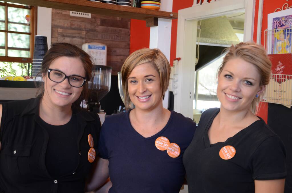 The team at Short Street Store, Elle Schaefer, Tracey Petrie and Casey Craig, showed their support for the SES by participating in Wear Orange Wednesday.	Photo: TAYLOR JURD